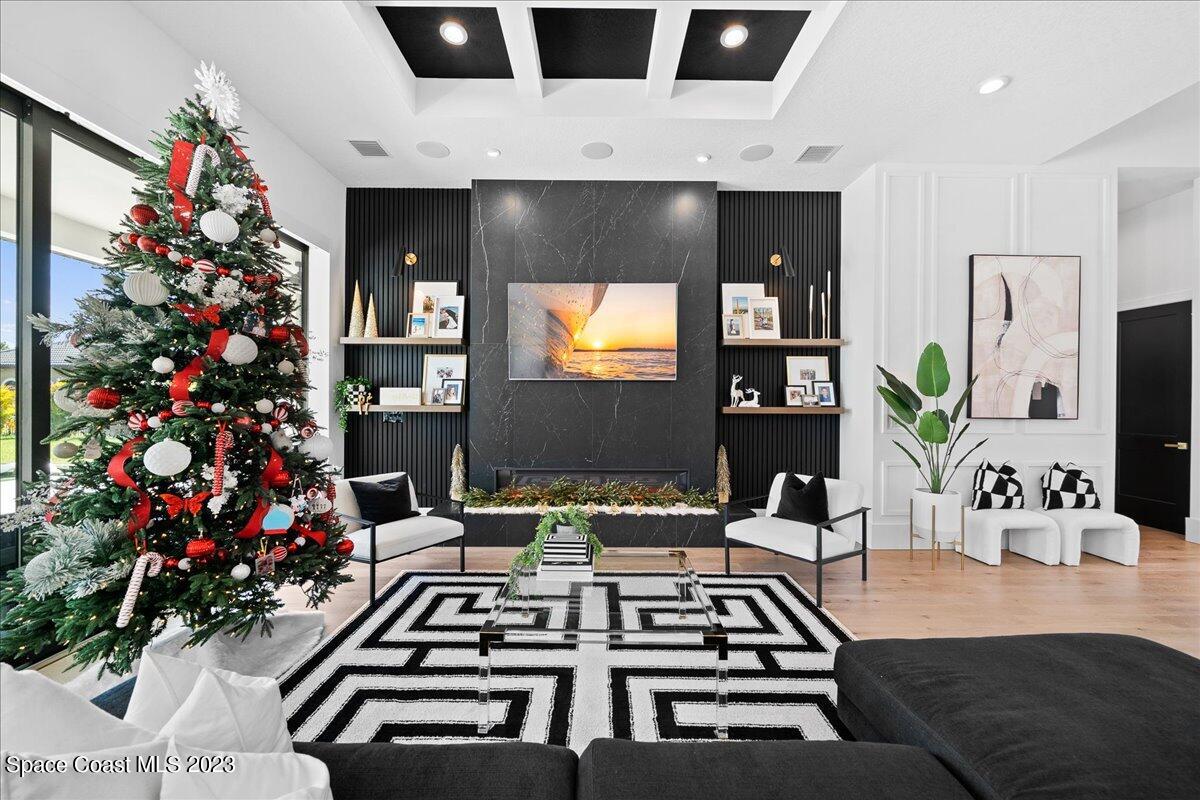 3022 BELLWIND Circle Rockledge, FL 32955 - Photo 9 of 46 a living room with a flat screen tv and flowers