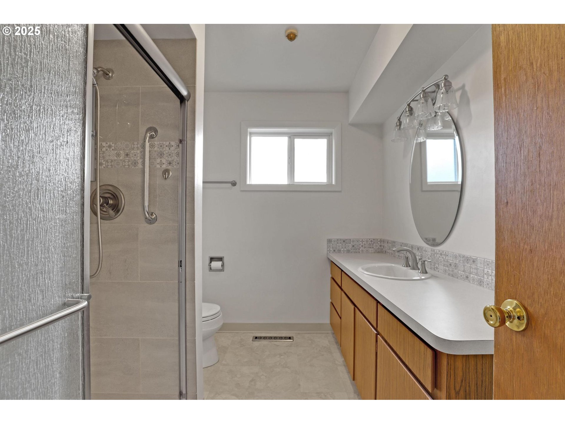11500 Southwest 90th Avenue Portland, OR 97223 - Photo 14 of 30 a bathroom with a sink a mirror and a shower
