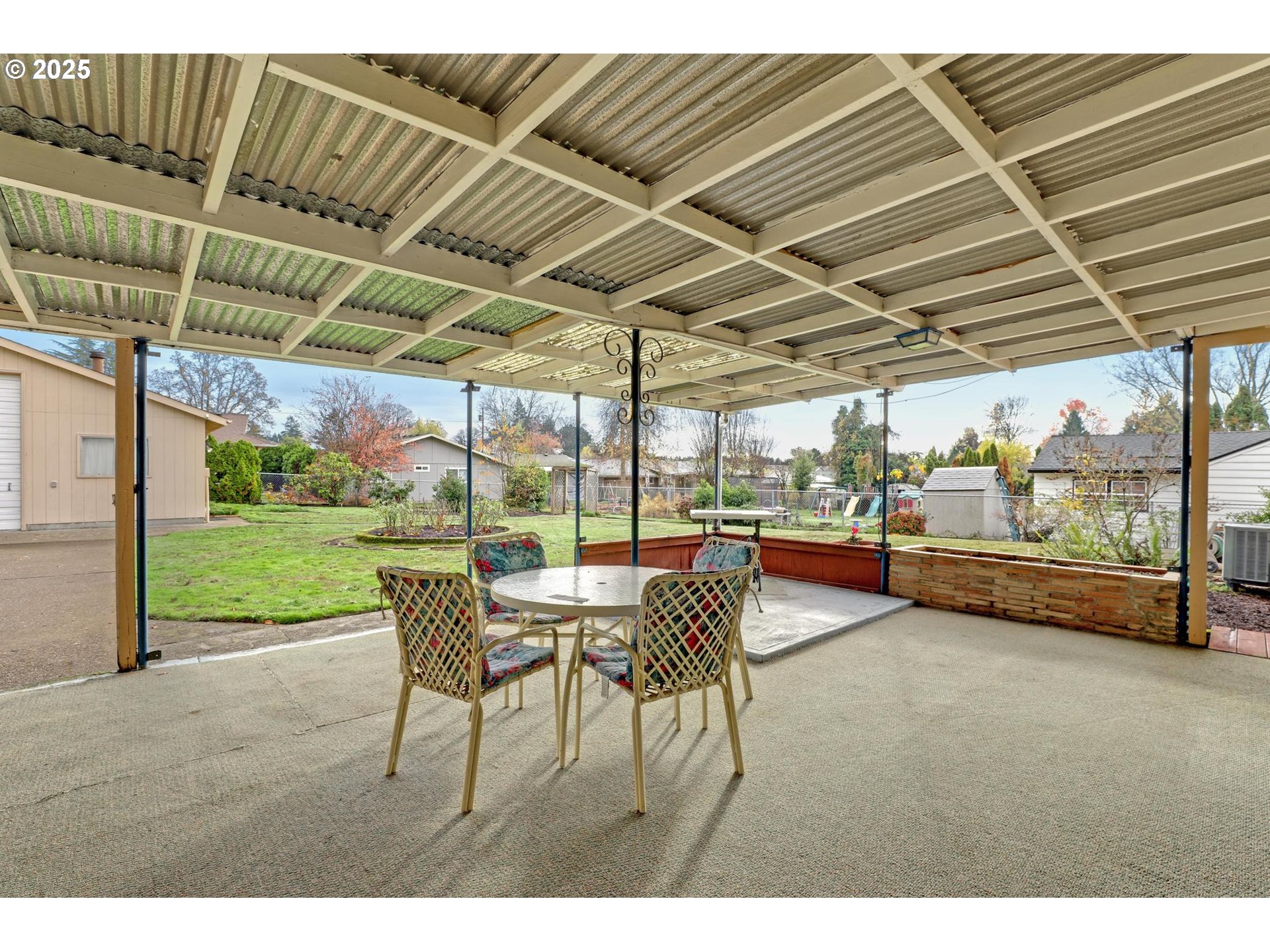 11500 Southwest 90th Avenue Portland, OR 97223 - Photo 22 of 30 a view of a patio with a table and chairs under an umbrella