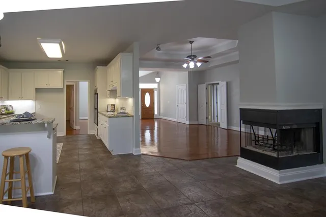 a view of livingroom with furniture wooden floor and windows