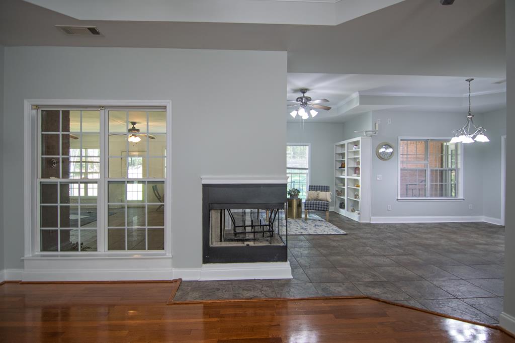 60 Roseanne Loop Hamilton, GA 31811 - Photo 12 of 54 a view of livingroom with furniture wooden floor and windows