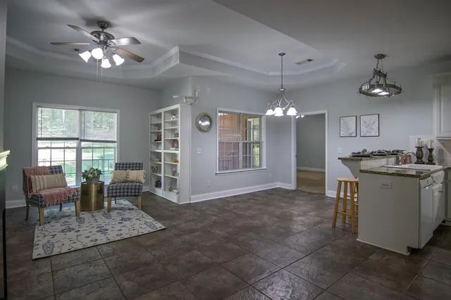 a kitchen with stainless steel appliances granite countertop a sink a stove a refrigerator and a oven