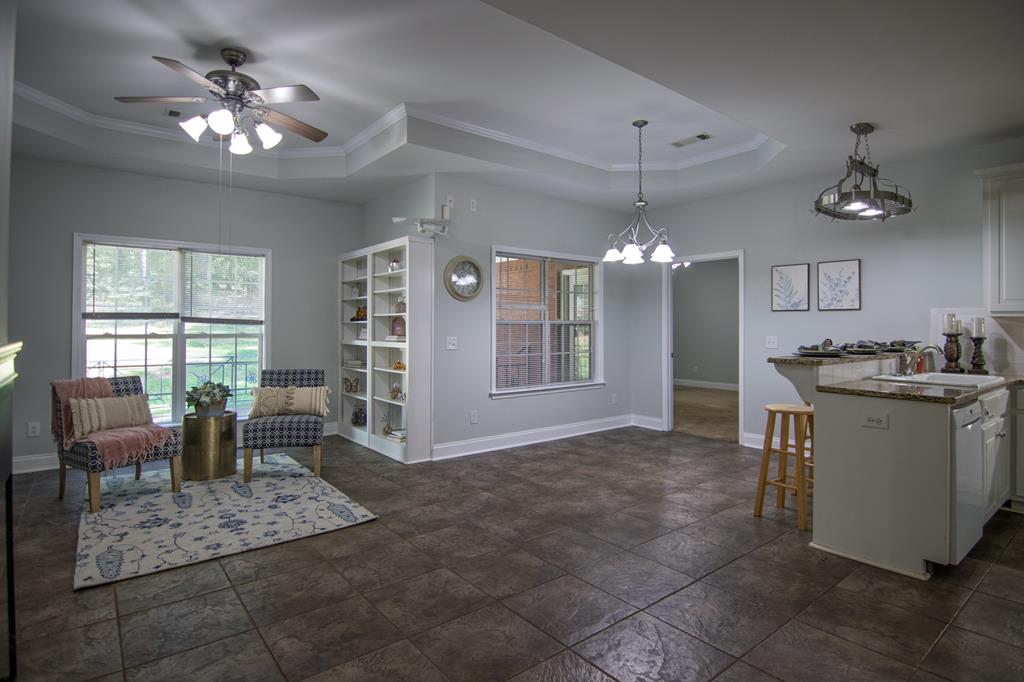 60 Roseanne Loop Hamilton, GA 31811 - Photo 15 of 54 a view of a livingroom with furniture window and wooden floor