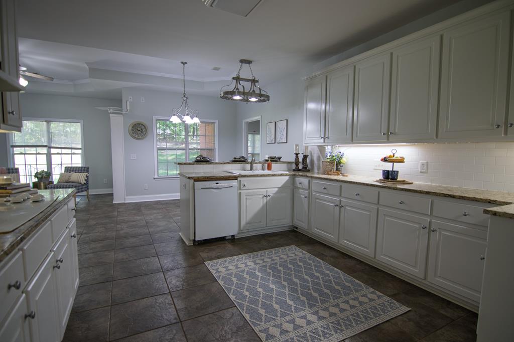 60 Roseanne Loop Hamilton, GA 31811 - Photo 21 of 54 a kitchen with a sink cabinets and window