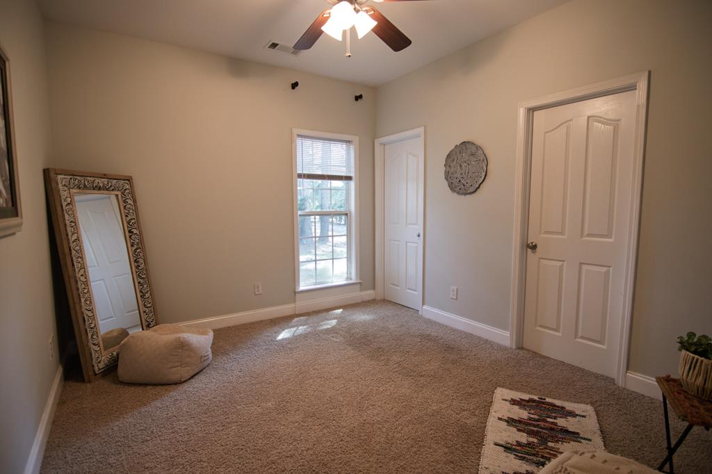 60 Roseanne Loop Hamilton, GA 31811 - Photo 35 of 54 an empty room with windows and closet