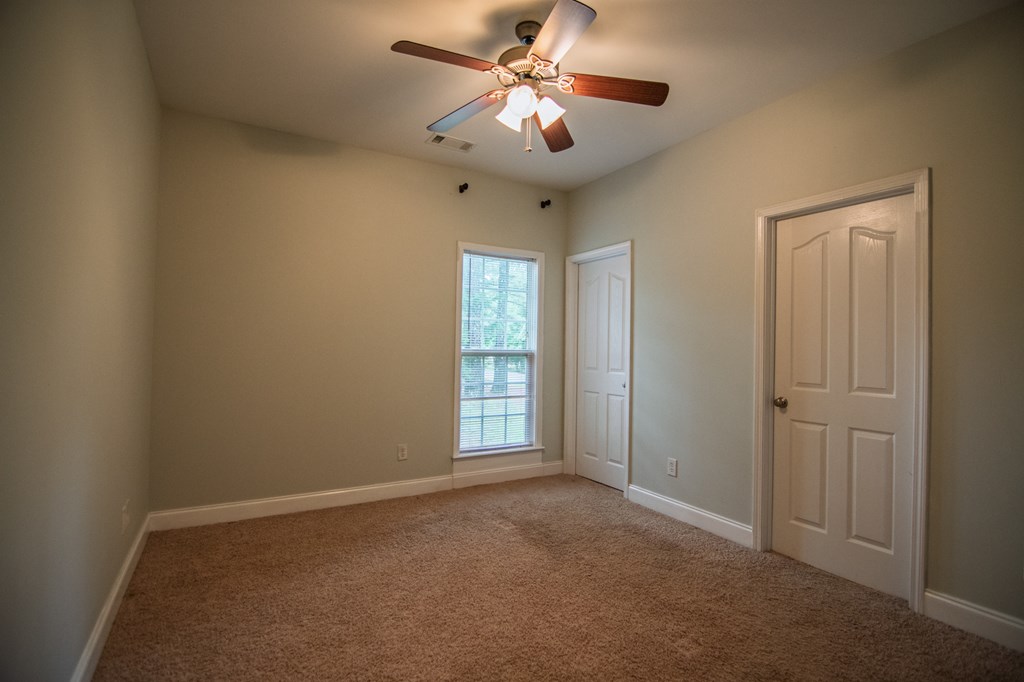 60 Roseanne Loop Hamilton, GA 31811 - Photo 39 of 54 a view of room with windows and ceiling fan