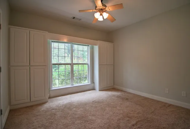 a living room with furniture and window