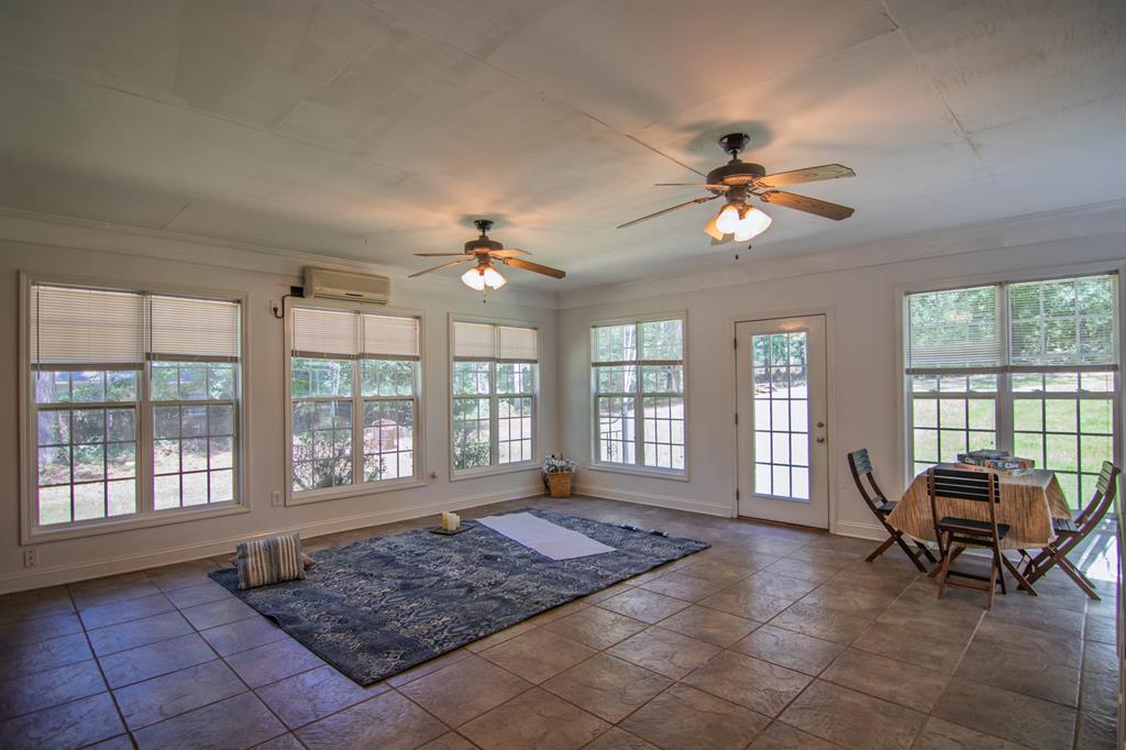 60 Roseanne Loop Hamilton, GA 31811 - Photo 44 of 54 a living room with furniture and a window