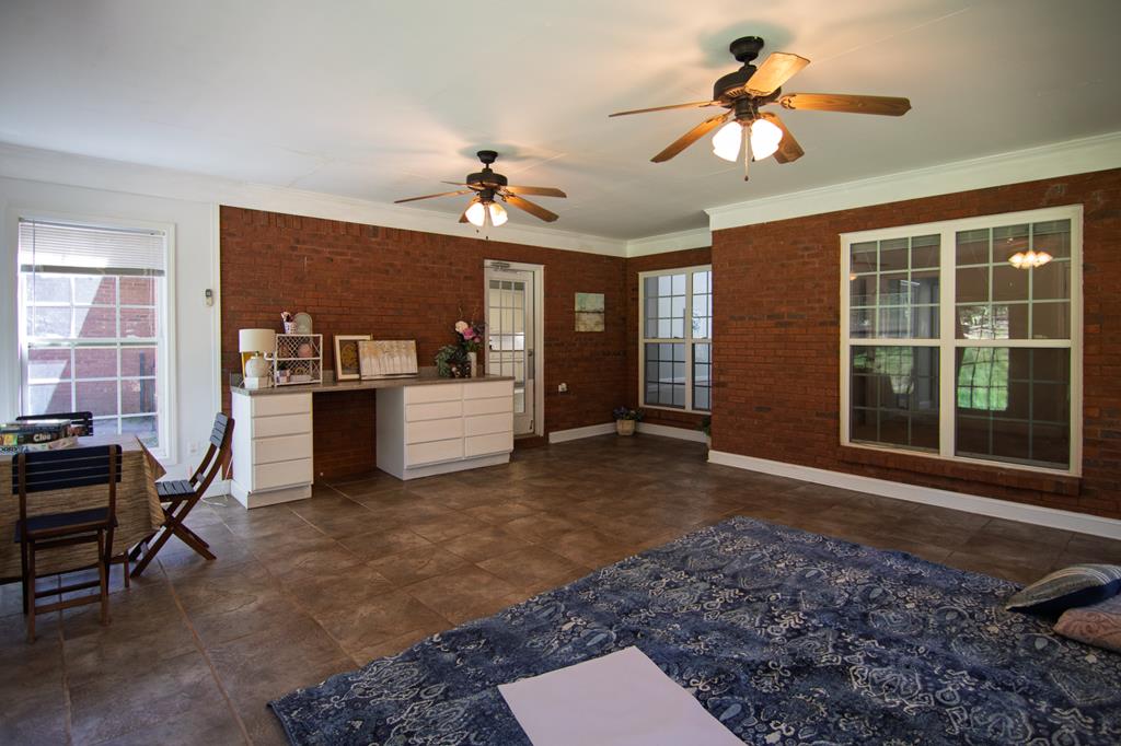 60 Roseanne Loop Hamilton, GA 31811 - Photo 48 of 54 a living room with furniture and a window