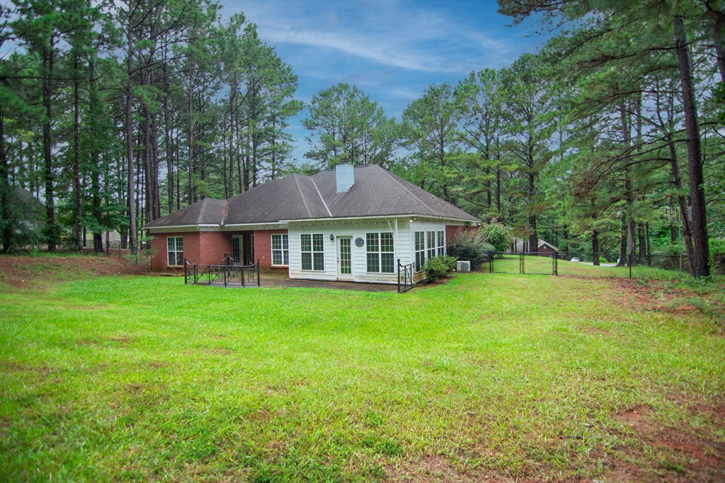 60 Roseanne Loop Hamilton, GA 31811 - Photo 49 of 54 a view of a house with a yard