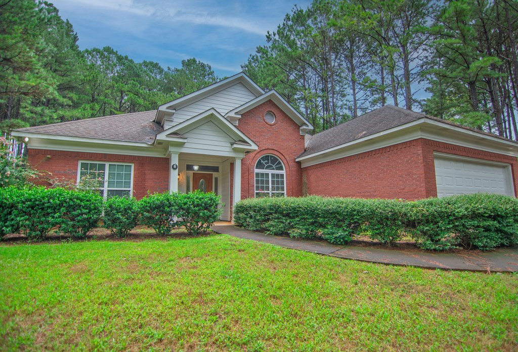 60 Roseanne Loop Hamilton, GA 31811 - Photo 5 of 54 a front view of a house with a yard