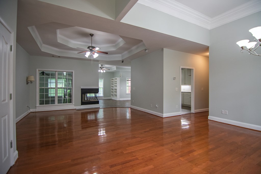 60 Roseanne Loop Hamilton, GA 31811 - Photo 7 of 54 a view of an empty room with wooden floor and a window