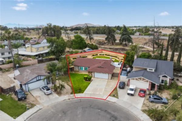 an aerial view of multiple houses with yard