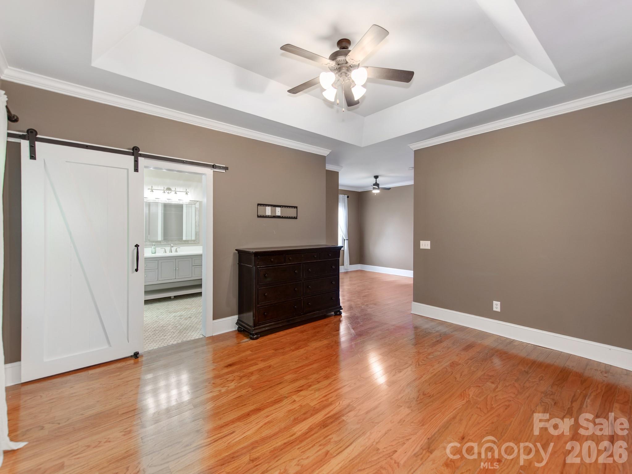 783 Sloan Street Denver, NC 28037 - Photo 15 of 44 wooden floor in an empty room with a window