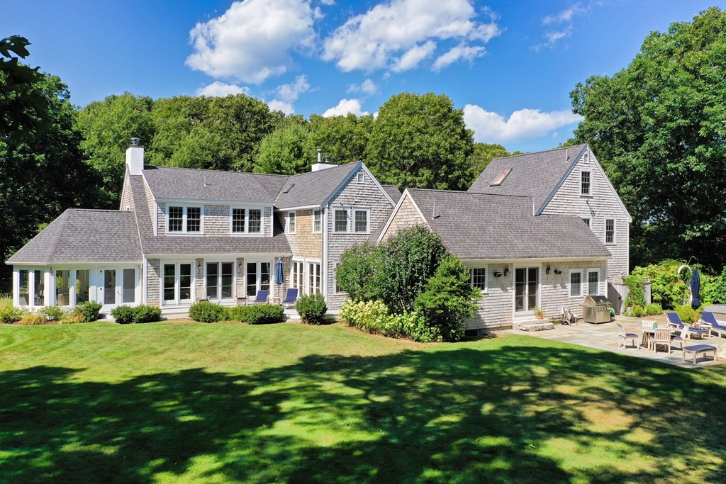 90 Old Dam Road Bourne, MA 02532 - Photo 1 of 41 a front view of a house with a yard