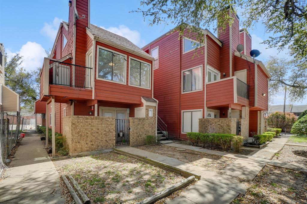 9821 Walnut Street, Unit 204 Dallas, TX 75243 - Photo 1 of 32 a view of a building with a yard