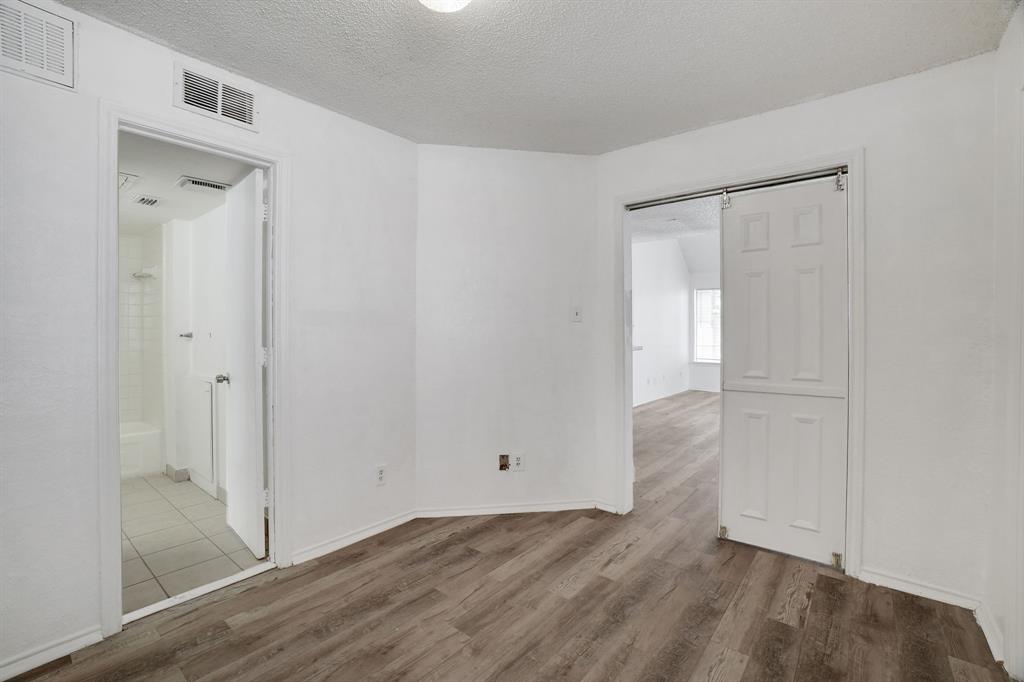 9821 Walnut Street, Unit 204 Dallas, TX 75243 - Photo 21 of 32 a view of an empty room