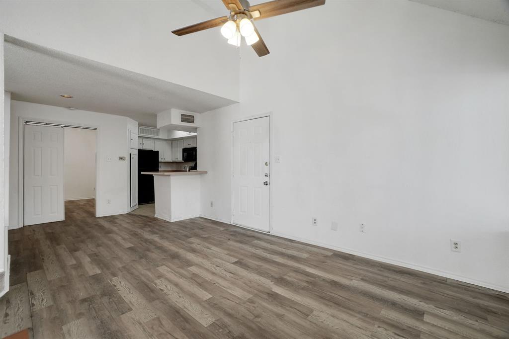 9821 Walnut Street, Unit 204 Dallas, TX 75243 - Photo 6 of 32 a view of a kitchen with a sink and a refrigerator