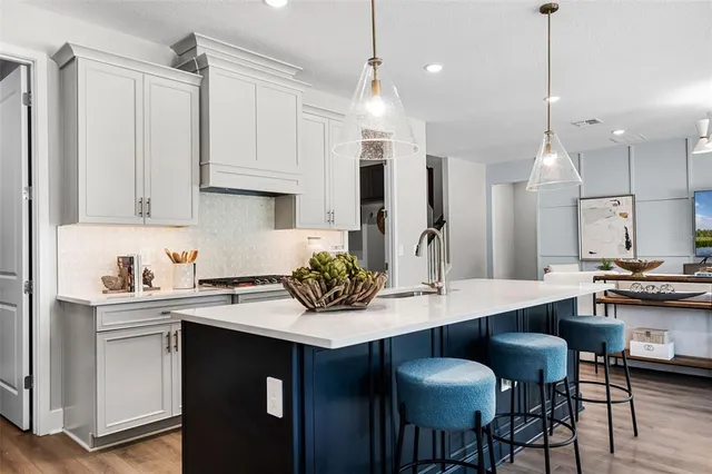 a kitchen with a sink cabinets and counter space