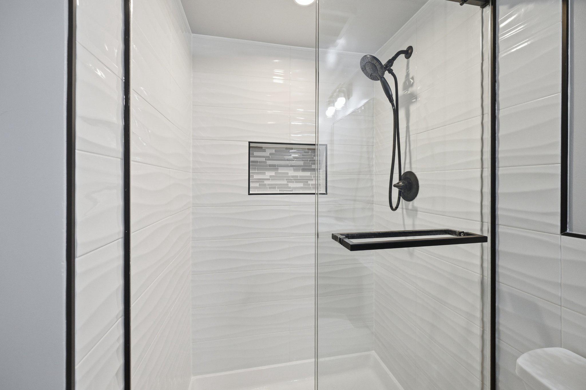9523 Rockport Road Vienna, VA 22180 - Photo 30 of 53 with sleek modern tile and black fixtures!