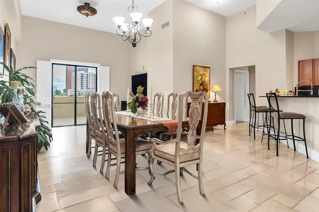 a view of a dining room with furniture window and outside view