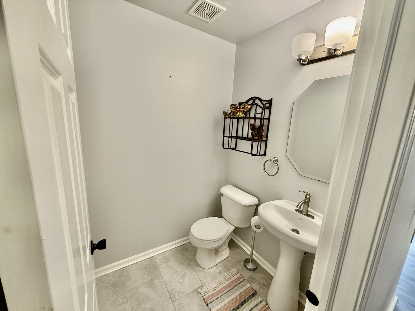 303 Springbrook Trail South Oswego, IL 60543 - Photo 11 of 14 a bathroom with a toilet and a mirror