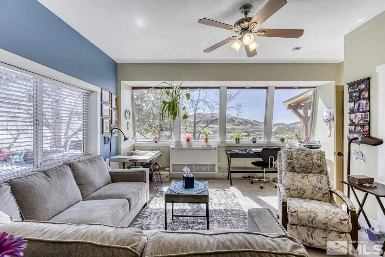 15555 Pyramid Way Reno, NV 89510 - Photo 24 of 39 a living room with furniture and a large window