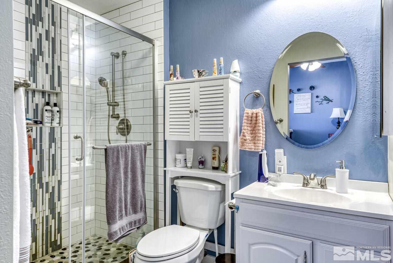 15555 Pyramid Way Reno, NV 89510 - Photo 25 of 39 a bathroom with a sink toilet and shower