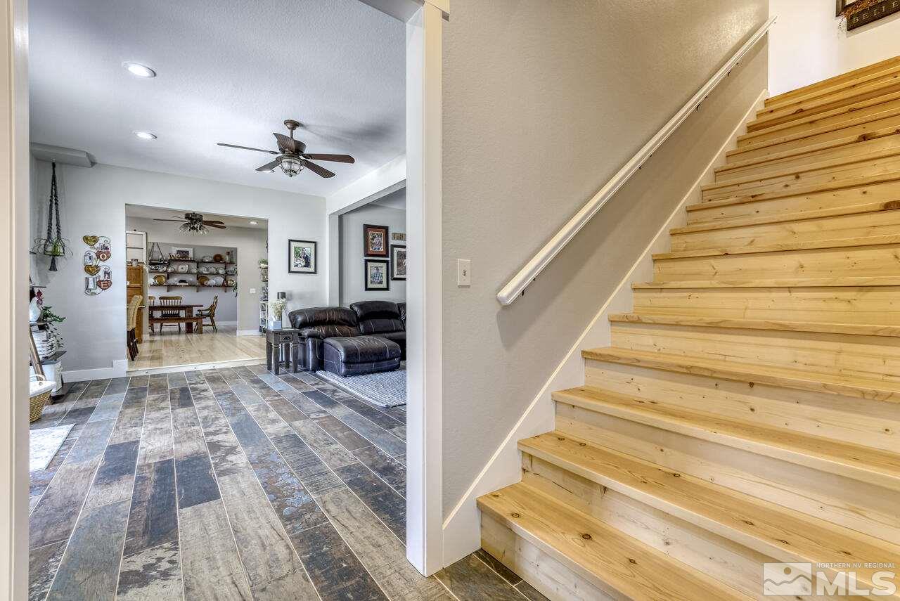 15555 Pyramid Way Reno, NV 89510 - Photo 26 of 39 a view of entryway and hall with wooden floor