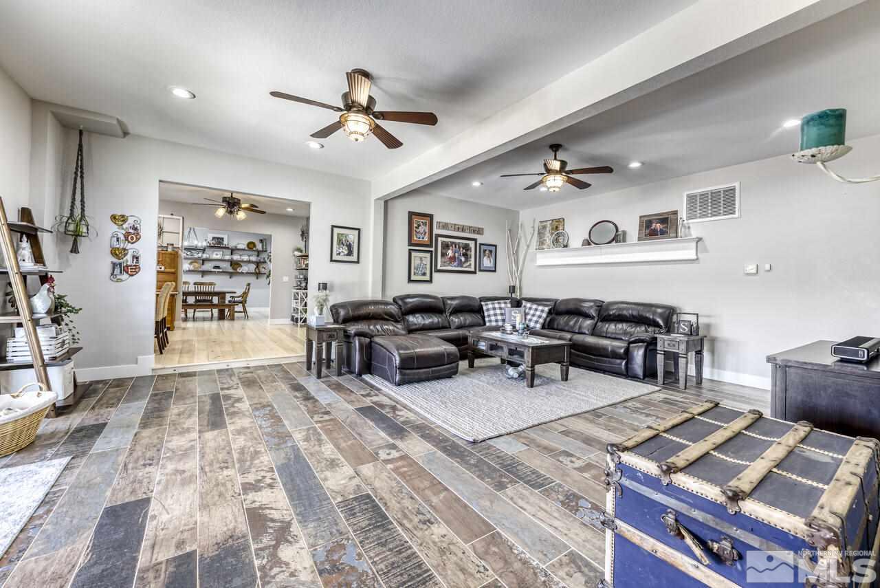 15555 Pyramid Way Reno, NV 89510 - Photo 35 of 39 a living room with lots of furniture and view of kitchen