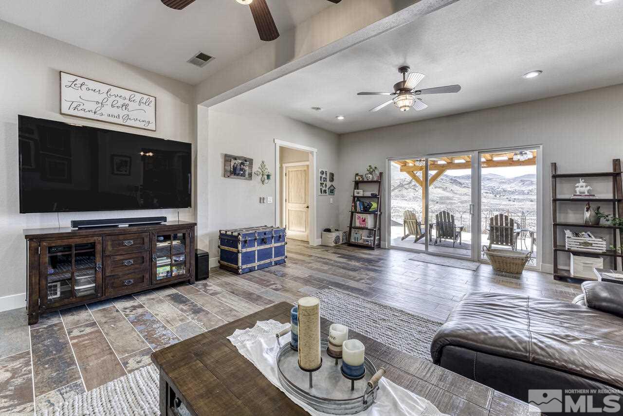 15555 Pyramid Way Reno, NV 89510 - Photo 36 of 39 a living room with furniture and a flat screen tv