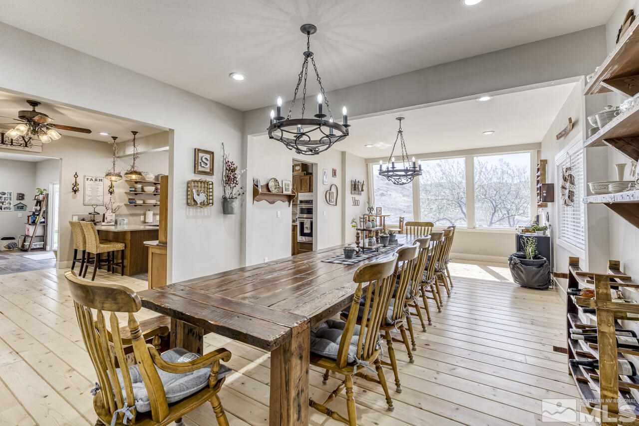 15555 Pyramid Way Reno, NV 89510 - Photo 37 of 39 a view of a dining room with furniture window and wooden floor