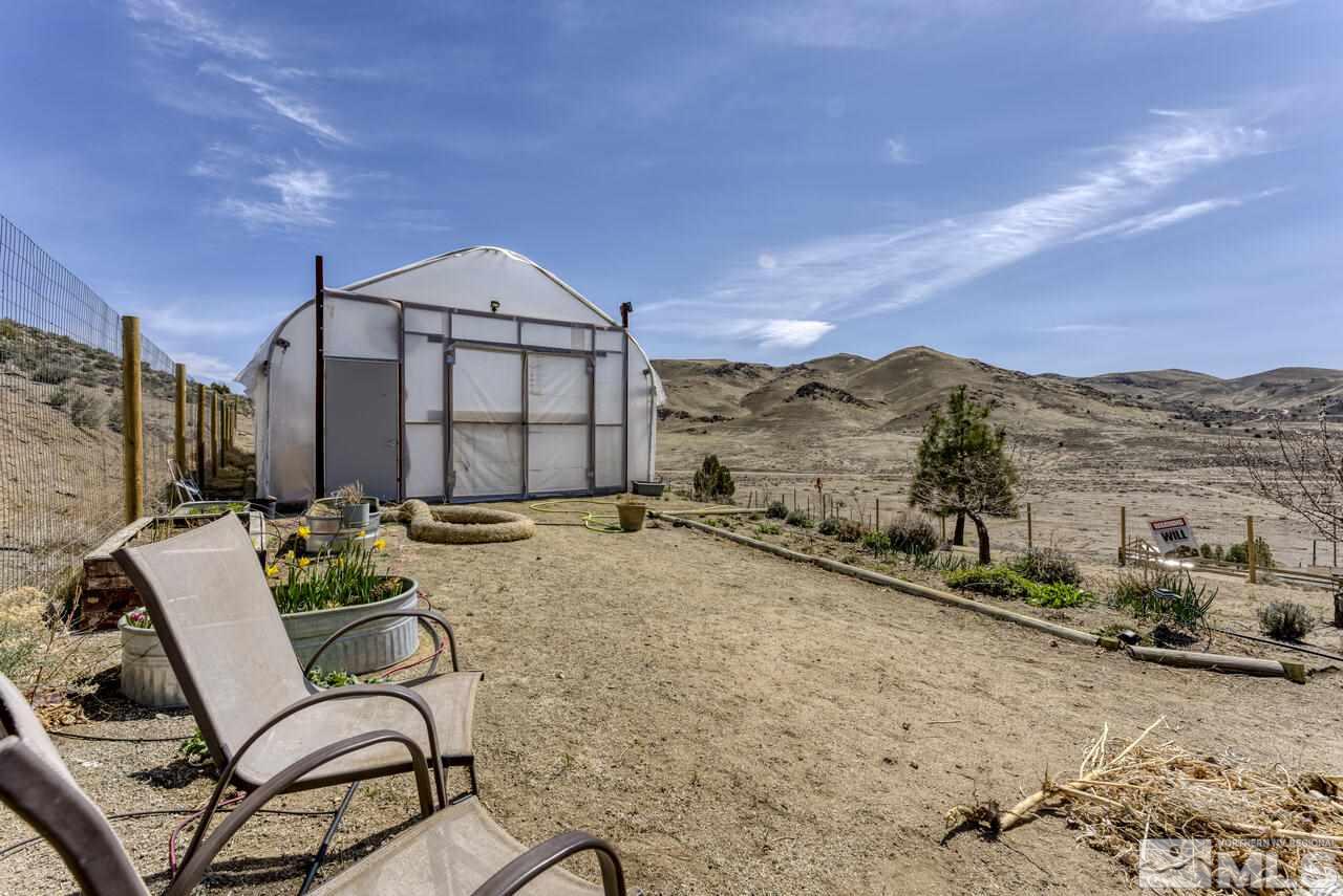 15555 Pyramid Way Reno, NV 89510 - Photo 5 of 39 a backyard of a house with table and chairs