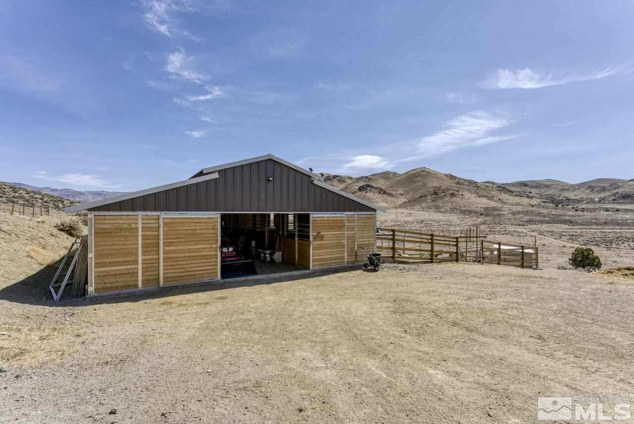 15555 Pyramid Way Reno, NV 89510 - Photo 6 of 39 a view of a house with a yard