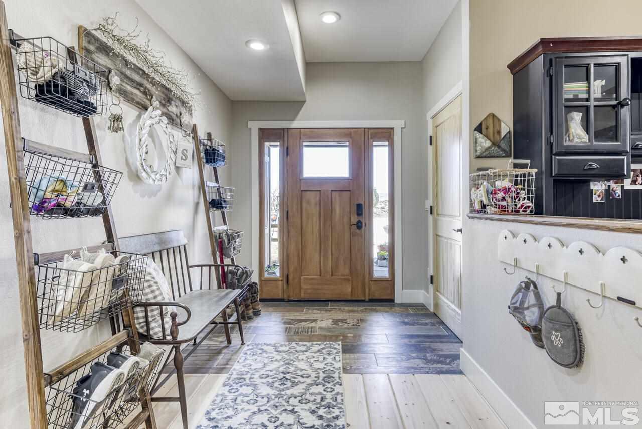 15555 Pyramid Way Reno, NV 89510 - Photo 8 of 39 a view of entryway with furniture and wooden floor