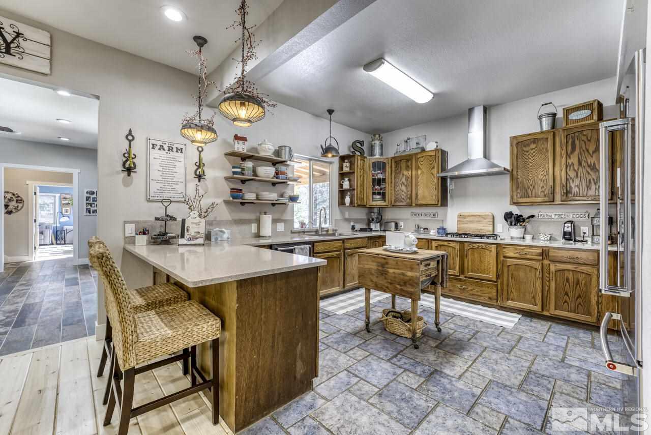 15555 Pyramid Way Reno, NV 89510 - Photo 10 of 39 a kitchen with cabinets a sink and appliances