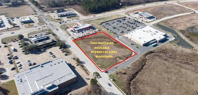 a view of a backyard with wooden fence
