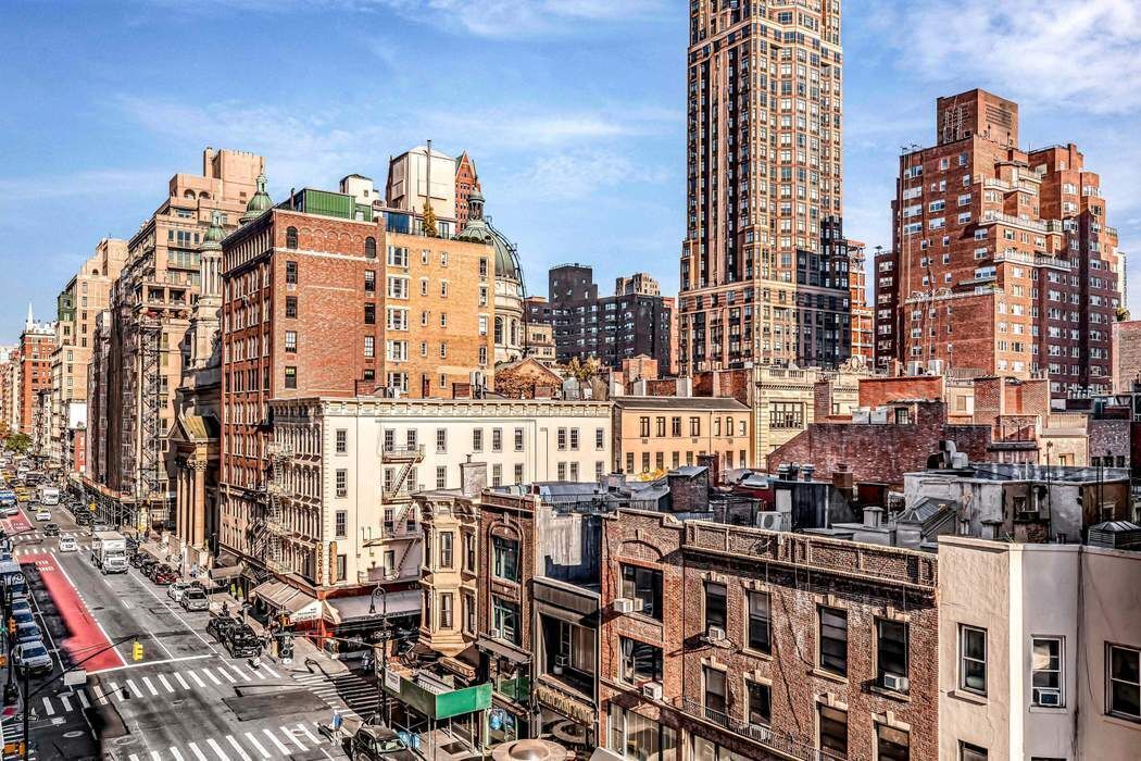 135 East 74th Street, Unit 6C Manhattan, NY 10021 - Photo 7 of 8 a view of a city that has tall buildings