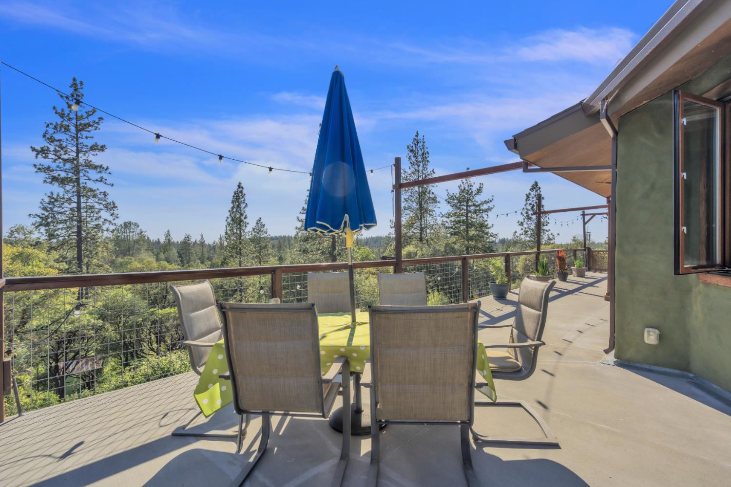 12767 Newtown Road Nevada City, CA 95959 - Photo 20 of 57 a view of a chair and table in the balcony