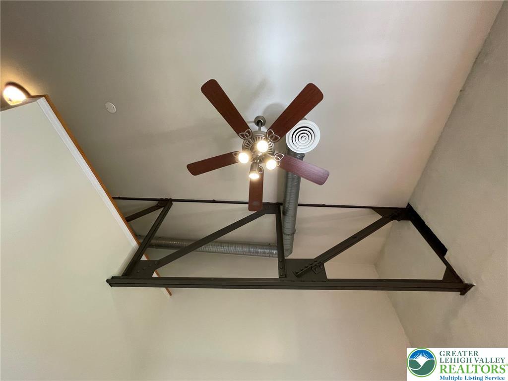 147 South 4th Street, Unit 15 Easton, PA 18042 - Photo 13 of 15 a lamp on a wall with a chandelier