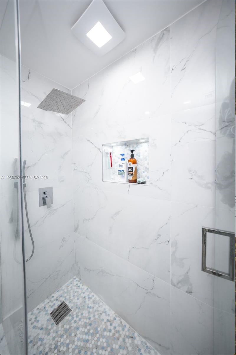 17404 Southwest 142nd Place Miami, FL 33177 - Photo 16 of 29 a bathroom with a shower