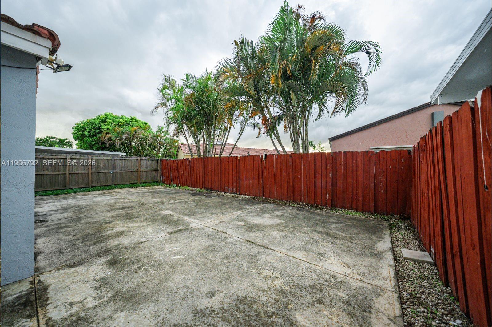 17404 Southwest 142nd Place Miami, FL 33177 - Photo 22 of 29 a view of outdoor space with wooden fence
