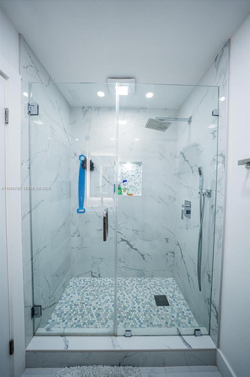 17404 Southwest 142nd Place Miami, FL 33177 - Photo 10 of 29 a bathroom with a shower
