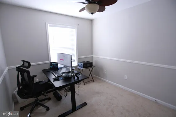 a workspace with furniture and window