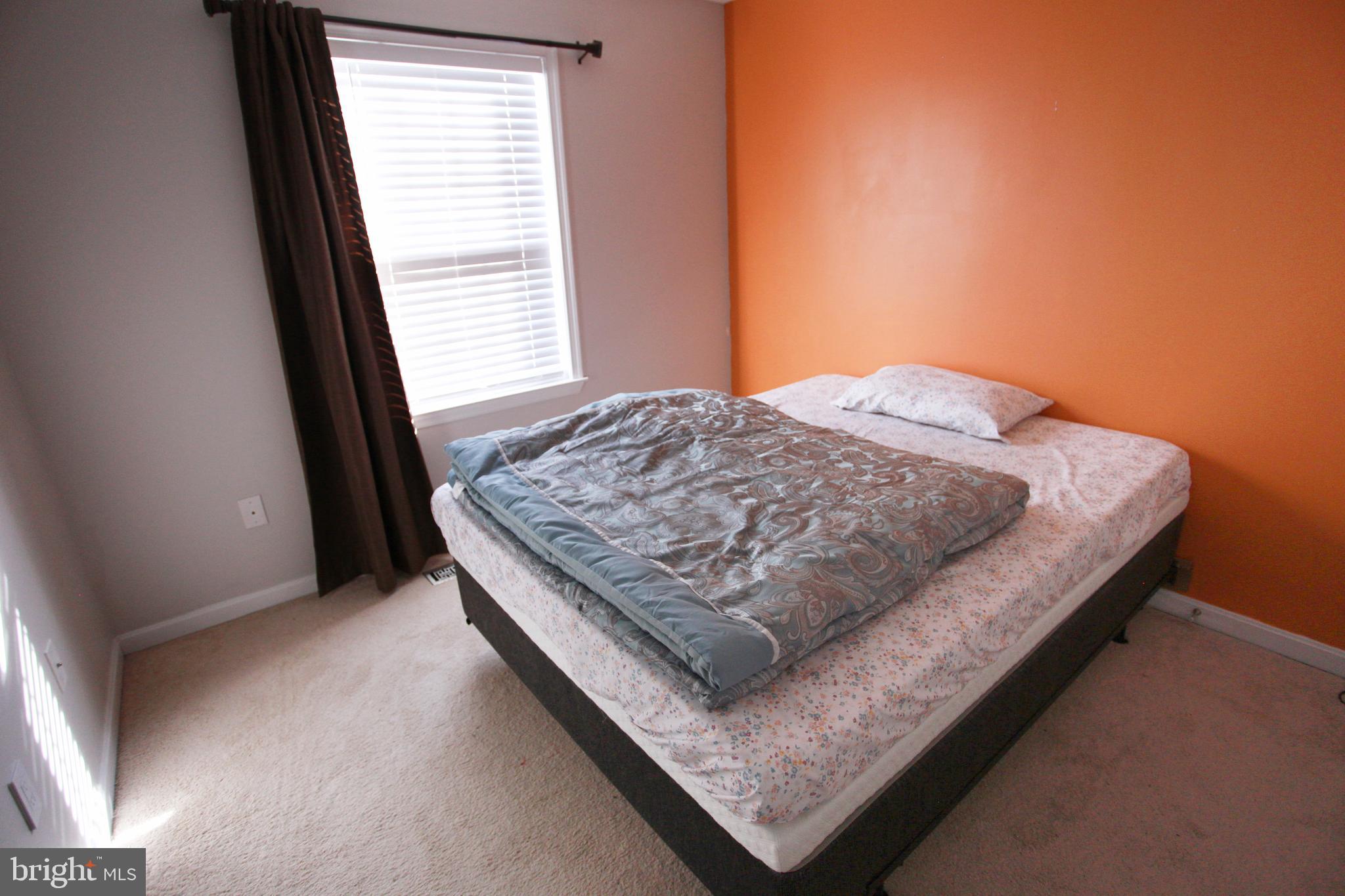 580 Primus Court Frederick, MD 21703 - Photo 9 of 14 a bedroom with bed and window