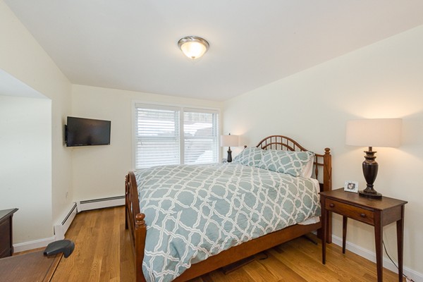 3 Pingree Farm Road Georgetown, MA 01833 - Photo 20 of 28 a bedroom with a bed and a flat screen tv