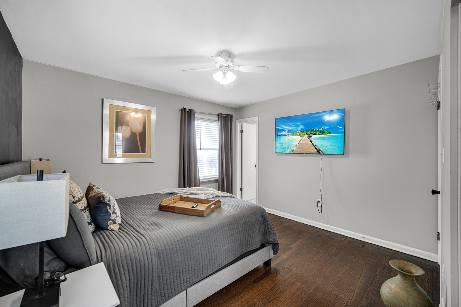 17509 Maple Avenue Lansing, IL 60438 - Photo 14 of 27 a bedroom with a bed and a chandelier