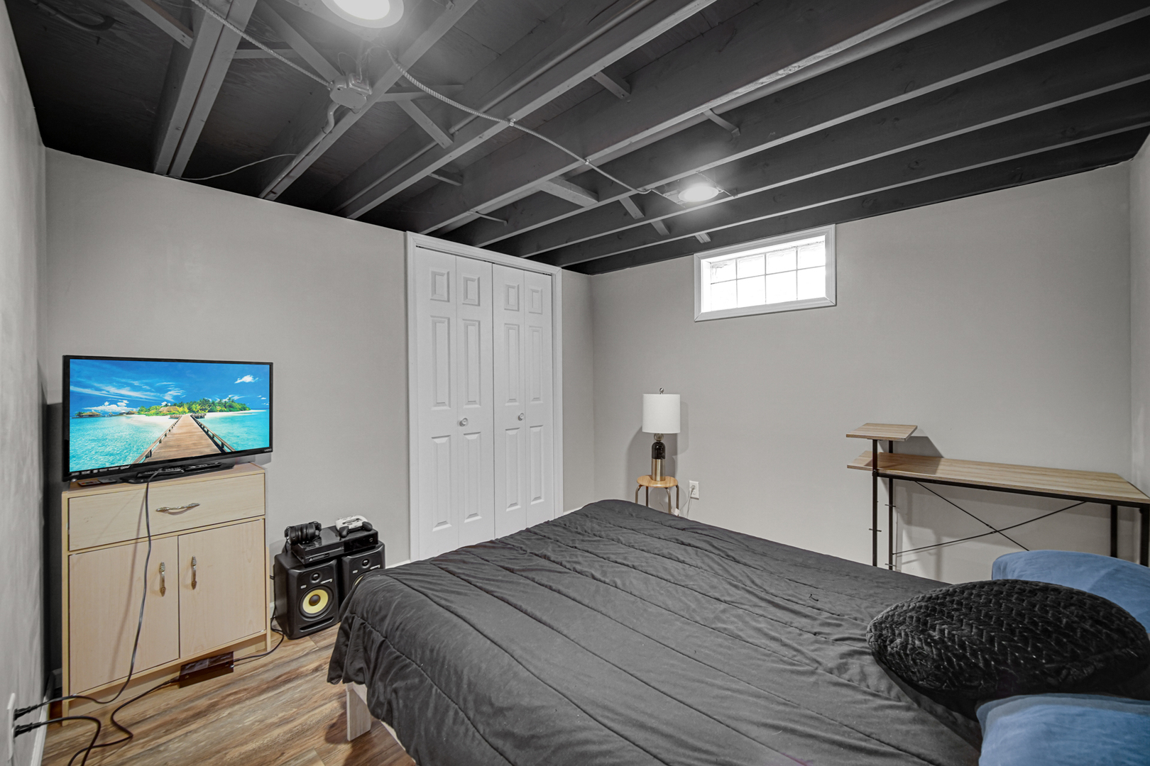 17509 Maple Avenue Lansing, IL 60438 - Photo 16 of 27 a bedroom with a bed and a flat screen tv