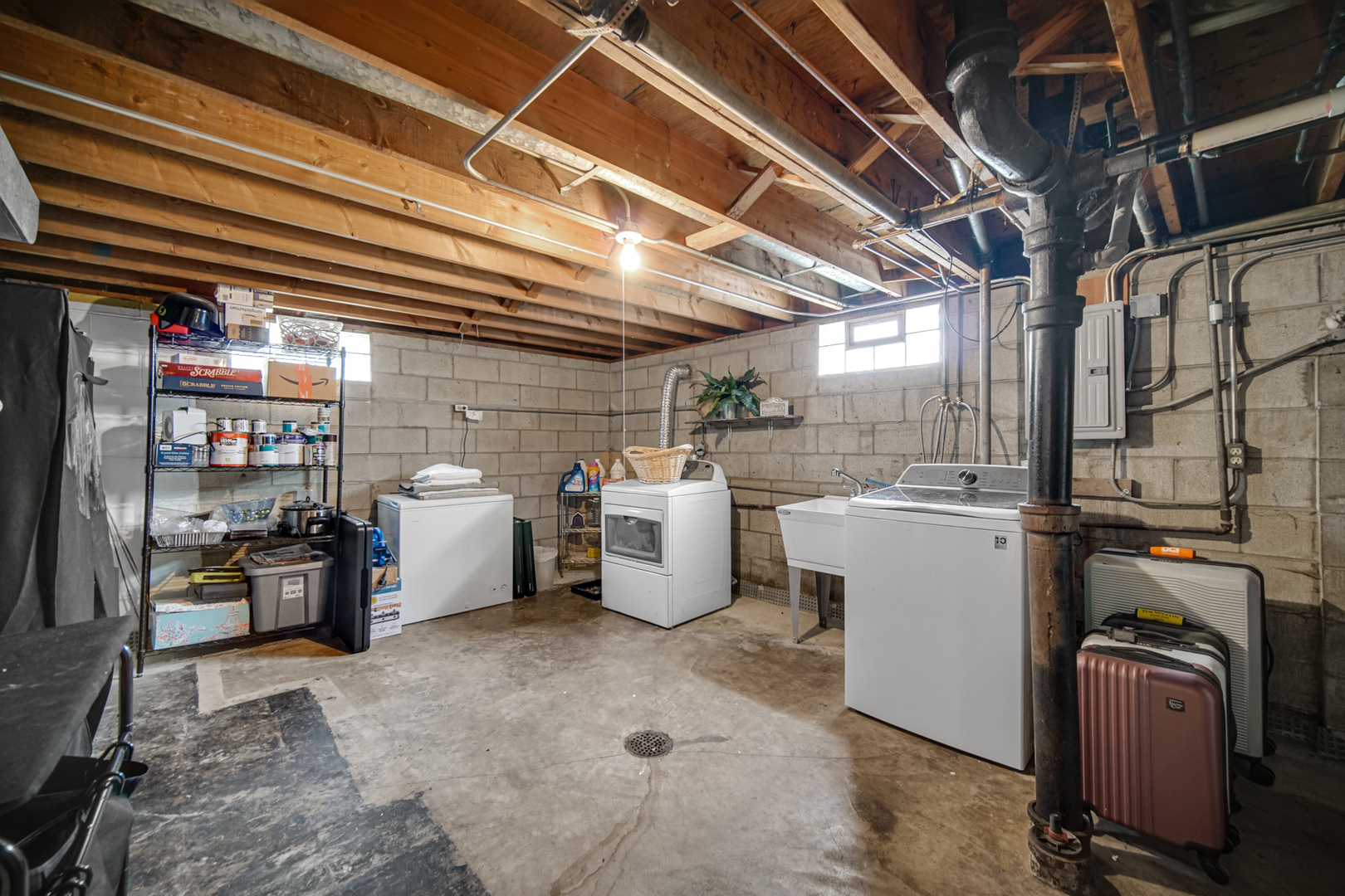 17509 Maple Avenue Lansing, IL 60438 - Photo 21 of 27 a view of a storage room with water heater and racks