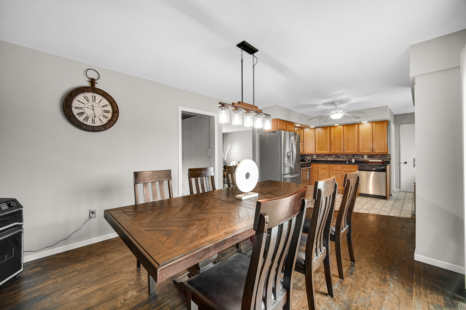 17509 Maple Avenue Lansing, IL 60438 - Photo 5 of 27 a view of a dining room with furniture wooden floor and chandelier